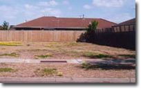 Photo of a vacant block of land.