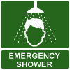 A green and white sign with a cartoon of a person's head under a spray of water from a shower. Under the picture are the words 'Emergency shower'.