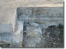 Photo of a concrete slab with a ledge. 