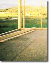 Photo of timber frame under construction.