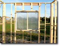 Photo of a wall frame with a window in place.